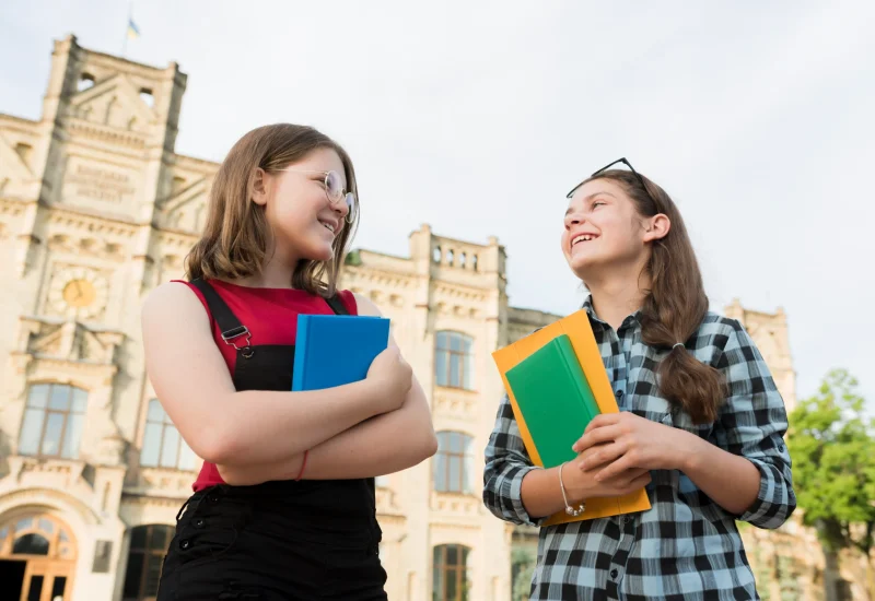 low-angle-medium-shot-teenage-girls-talking